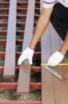 Worker Installing  Wood Floor Stock Photo