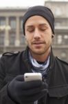 Man With Mobile Phone In Hands Stock Photo