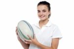 Attractive Sporty Girl Posing With Rugby Ball Stock Photo