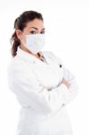 Side Pose Of Doctor With Mask And Folded Hands Stock Photo