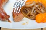 Beef Sausages Cooked On Iron Skillet Stock Photo