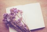 Blank Notebook And Dried Statice Flowers With Retro Filter Effec Stock Photo