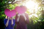 Loving Couple. Beautiful Young Loving Couple Holding Paper Heart Stock Photo