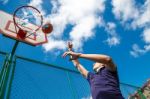 Young Man Playing Basketball Stock Photo