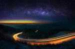 Milky Way And Car Light On Road At Doi Inthanon National Park In The Night, Chiang Mai, Thailand Stock Photo