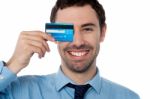 Businessman Hiding His Eye With Credit Card Stock Photo