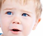 Toddler Blond And Blue Eyes Boy Child With Various Facial Expres Stock Photo