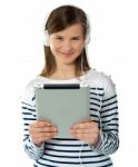 Smiling Girl Holding I-pad Stock Photo