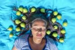 Young Woman  Lying Eyes Closed Pears In Black Hair Stock Photo