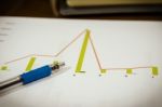 Graphs And Pen Stock Photo