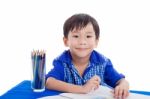 Boy Smiling And Drawing Stock Photo