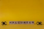 Halloween Wooden Blocks With Spiders On Yellow Background, Hallo Stock Photo