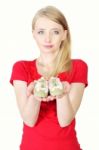 Woman Holding Baby Shoes Stock Photo