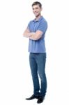 Smart Young Man With Crossed Arms Stock Photo