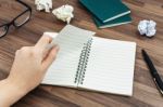 Office Desk With Hand Tearing Paper Stock Photo