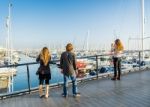 People Photographing Boats In The Marina In Brighton Stock Photo