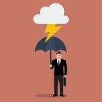 Businessman With Umbrella Protect From Thunder Stock Photo