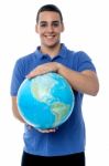 Young Man Holding Globe Map Stock Photo