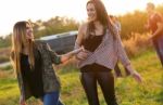 Portrait Of Group Of Friends Having Fun In Field Stock Photo