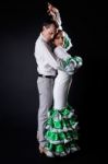 Young Flamenco Dancers In Beautiful Dress On Black Background Stock Photo