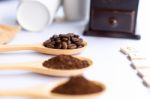 Wooden Spoons Filled With Coffee Bean And Crushed Ground Coffee Stock Photo