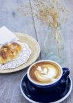 Breakfast Coffee And Almond Croissant Stock Photo