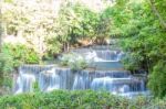 The Water Flowing Over Rocks And Trees Down A Waterfall At Huay Mae Khamin Waterfall National Park ,kanchana Buri In Thailand Stock Photo