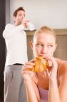 Couple In Kitchen Having Breakfast Stock Photo