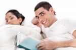 Young Man Reading Book Stock Photo