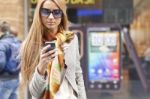 Young Fashionable Woman reading sms Stock Photo