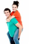 Male Giving Piggyback Ride Stock Photo