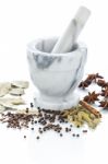 Marble Mortar And Pestle With Assorted Spices On White Backgroun Stock Photo