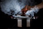 Hand Open Hot Steam Pot Stock Photo