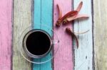 Coffee Cup On Colorful Wooden Panel Stock Photo