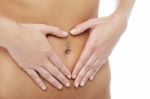 Woman's Hands Around Pierced Navel Stock Photo