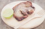 Pork Steak On Wooden Plate Stock Photo