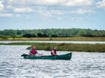 People Canoeing On The River Alde Stock Photo