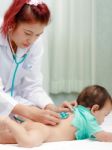 Female Doctor Checking Baby Petient Stock Photo