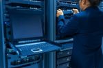 Man Fix Server Network In Data Center Room Stock Photo