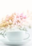 White Mug Cup And Static Flower Stock Photo