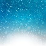 Falling Snow On The Blue Background Stock Photo