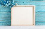 Wood Frame On Blue Wooden Background Stock Photo