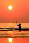 Silhouetted Woman On Beach  Stock Photo