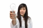 Young Woman With Light Bulb Stock Photo