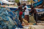 African Fisherman Woking In Hot Sunlight Stock Photo