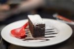 Brownies Topped With Chocolate With Red Spoon On The Dish Stock Photo