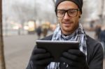 Man Holdin I-pad Tablet Computer On Street Stock Photo