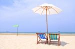 Beach Chairs And White Umbrella Stock Photo