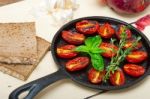 Baked Cherry Tomatoes With Basil And Thyme Stock Photo