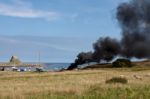 Fire On Holy Island Stock Photo